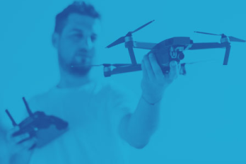man holding a drone