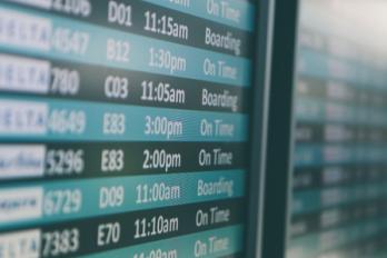 Flight status screen at an airport