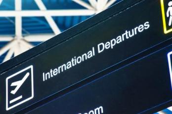 A sign for international departures at an airport