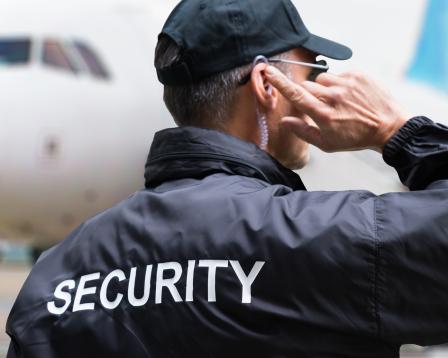 Security officer in front of an aircraft