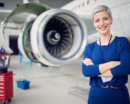 Woman in front of aircraft