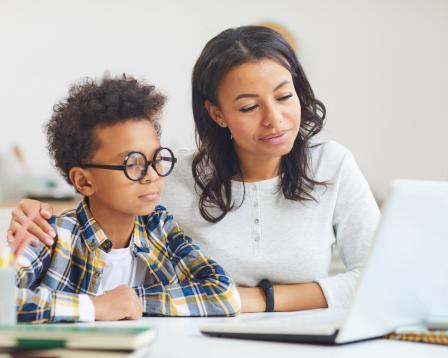 boy with woman at computer