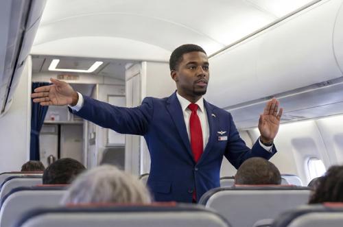 Flight attendant performing in-flight briefing
