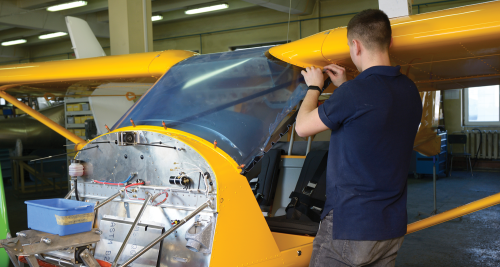 Picture of a person working on an airplane
