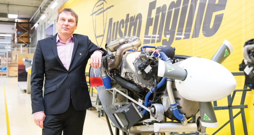 Picture of a man and an aircraft engine.