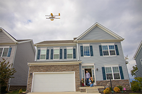 drone flying over a residential home